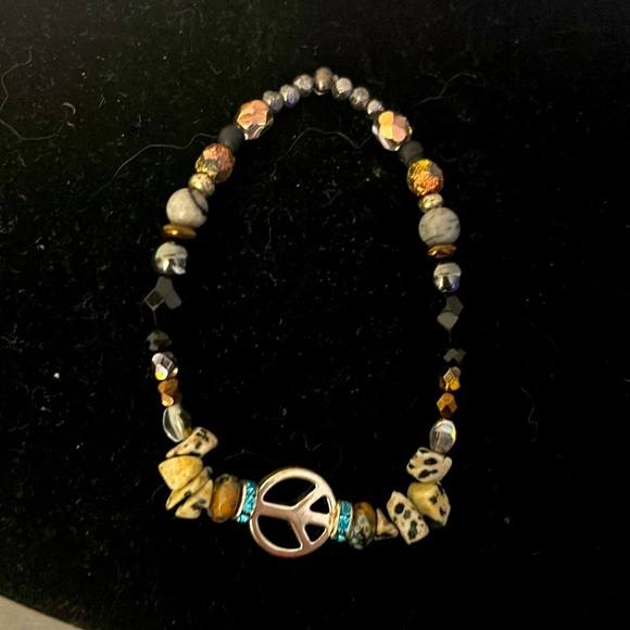 Funky stone bracelet wi silver peace sign.
